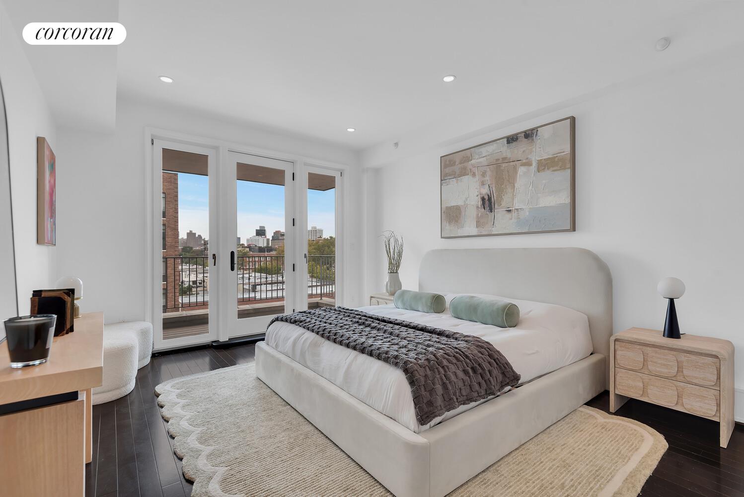 30-11 21st Street, Unit 5C Queens, NY 11102 - Photo 4 of 12 a spacious bedroom with a bed and a couch