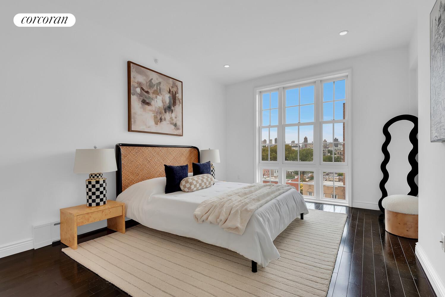 30-11 21st Street, Unit 5C Queens, NY 11102 - Photo 5 of 12 a bedroom with a bed and wooden floor