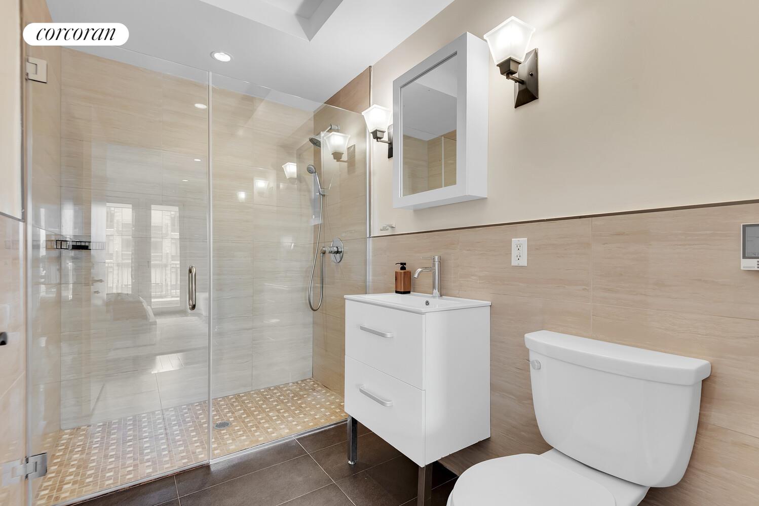 30-11 21st Street, Unit 5C Queens, NY 11102 - Photo 8 of 12 a bathroom with a toilet sink and shower