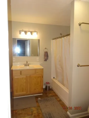 a bathroom with a sink and a mirror