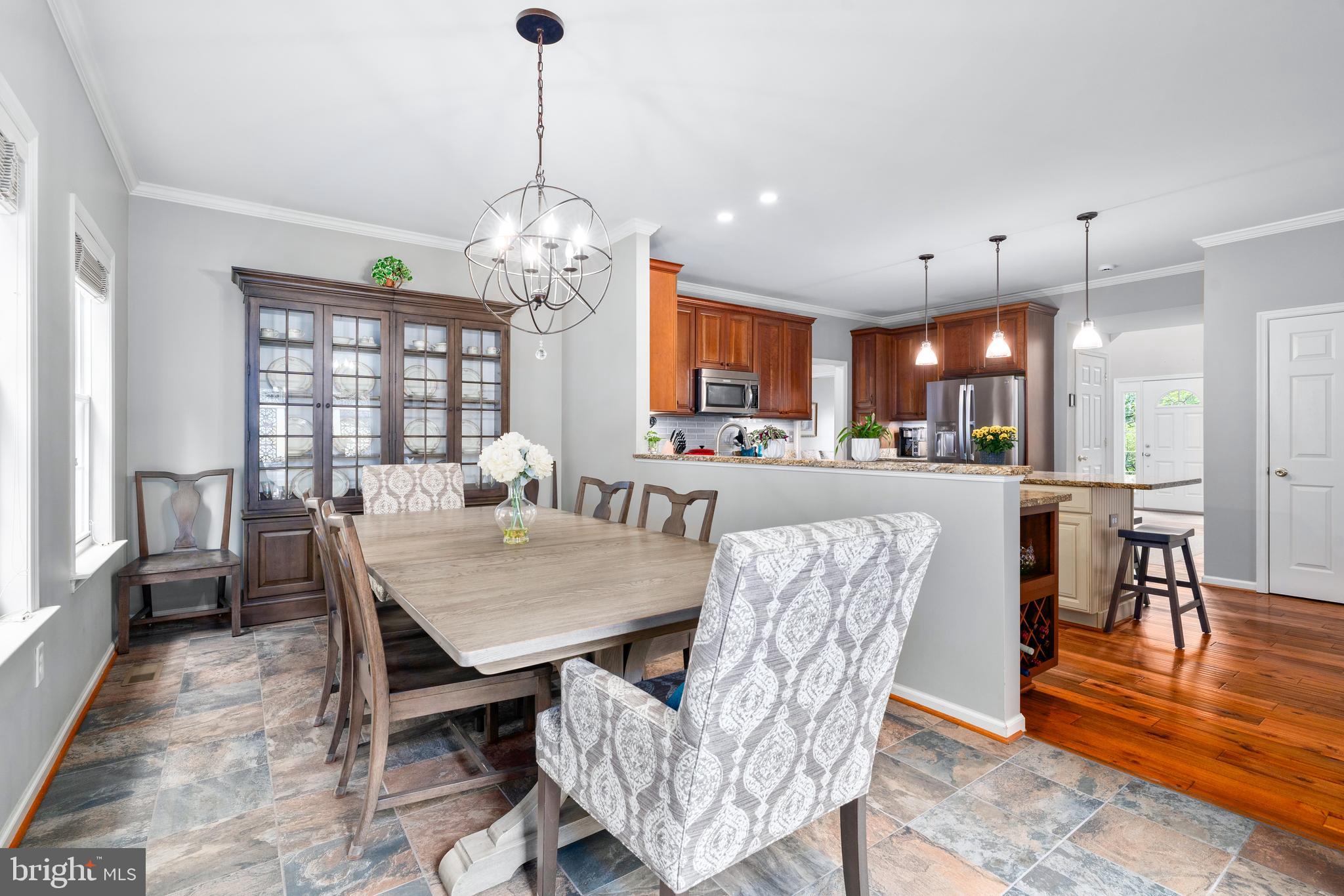 4644 Old Swimming Pool Road Braddock Heights, MD 21714 - Photo 15 of 60 a view of a dining room with furniture window and wooden floor