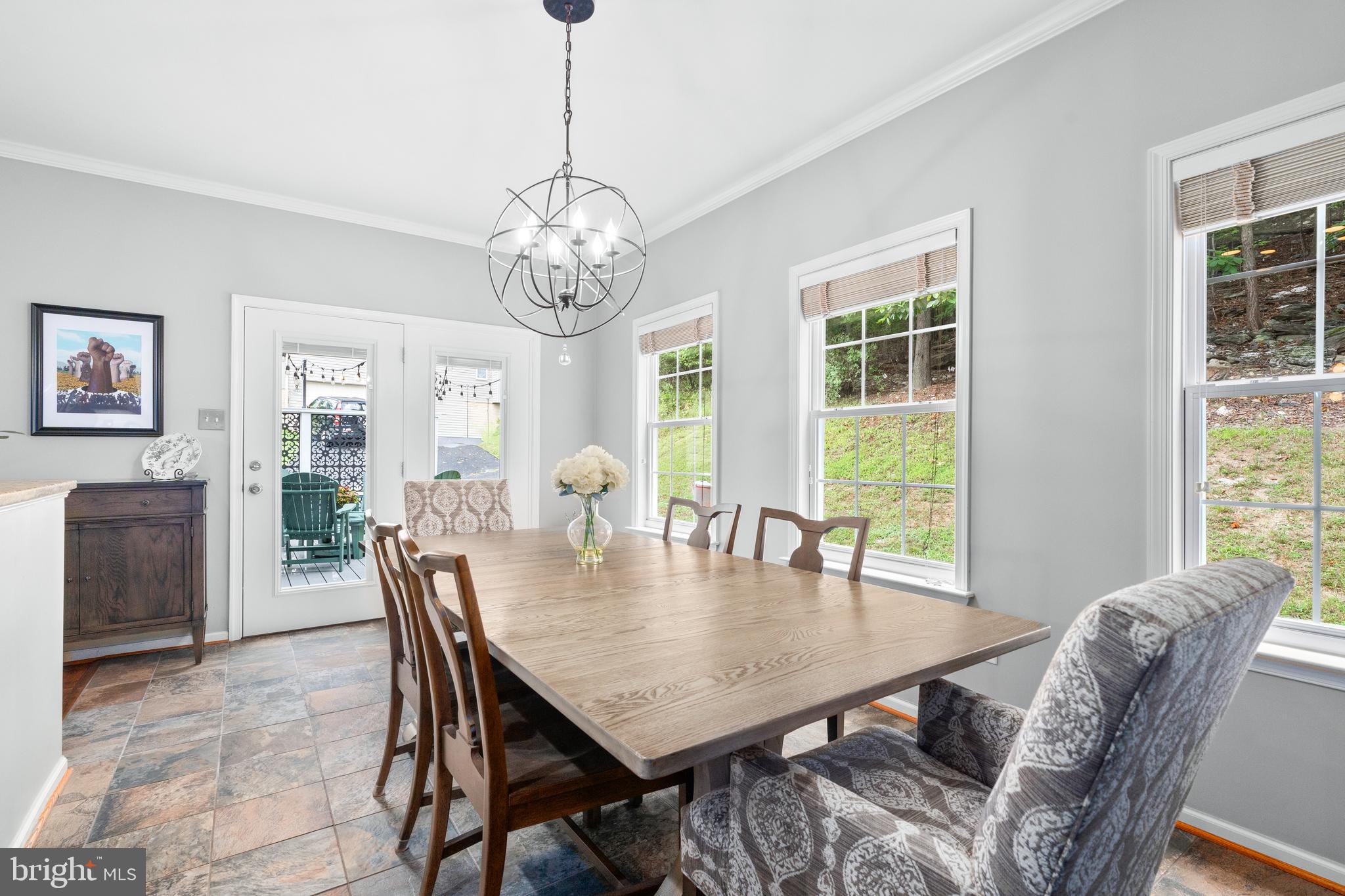 4644 Old Swimming Pool Road Braddock Heights, MD 21714 - Photo 16 of 60 a view of a dining room with furniture window and wooden floor
