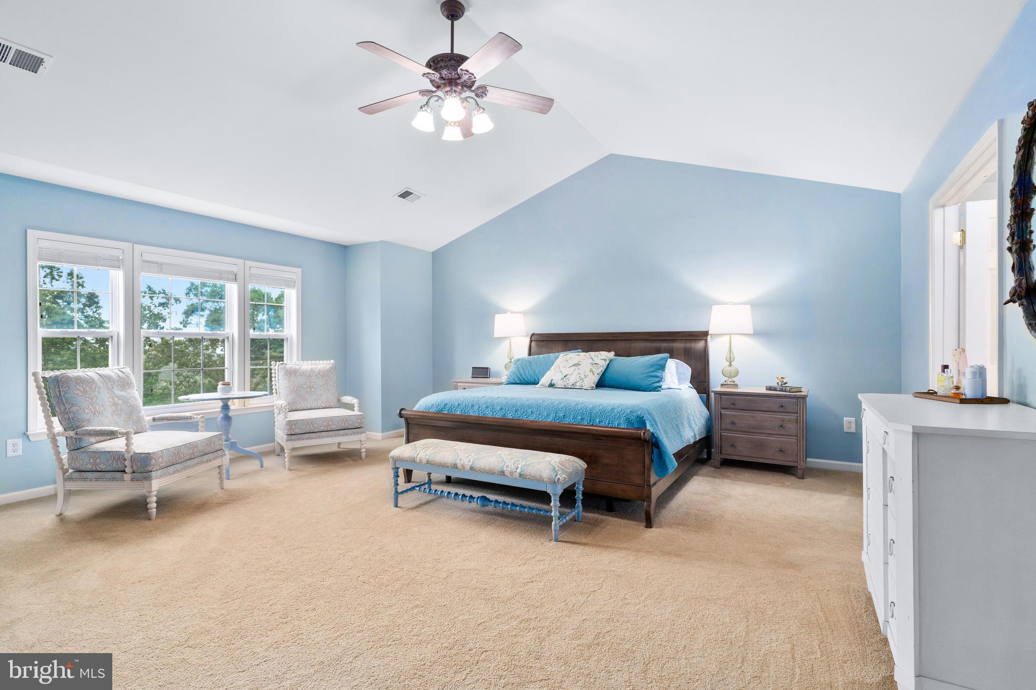 4644 Old Swimming Pool Road Braddock Heights, MD 21714 - Photo 27 of 60 a spacious bedroom with a bed a chandelier and a couch