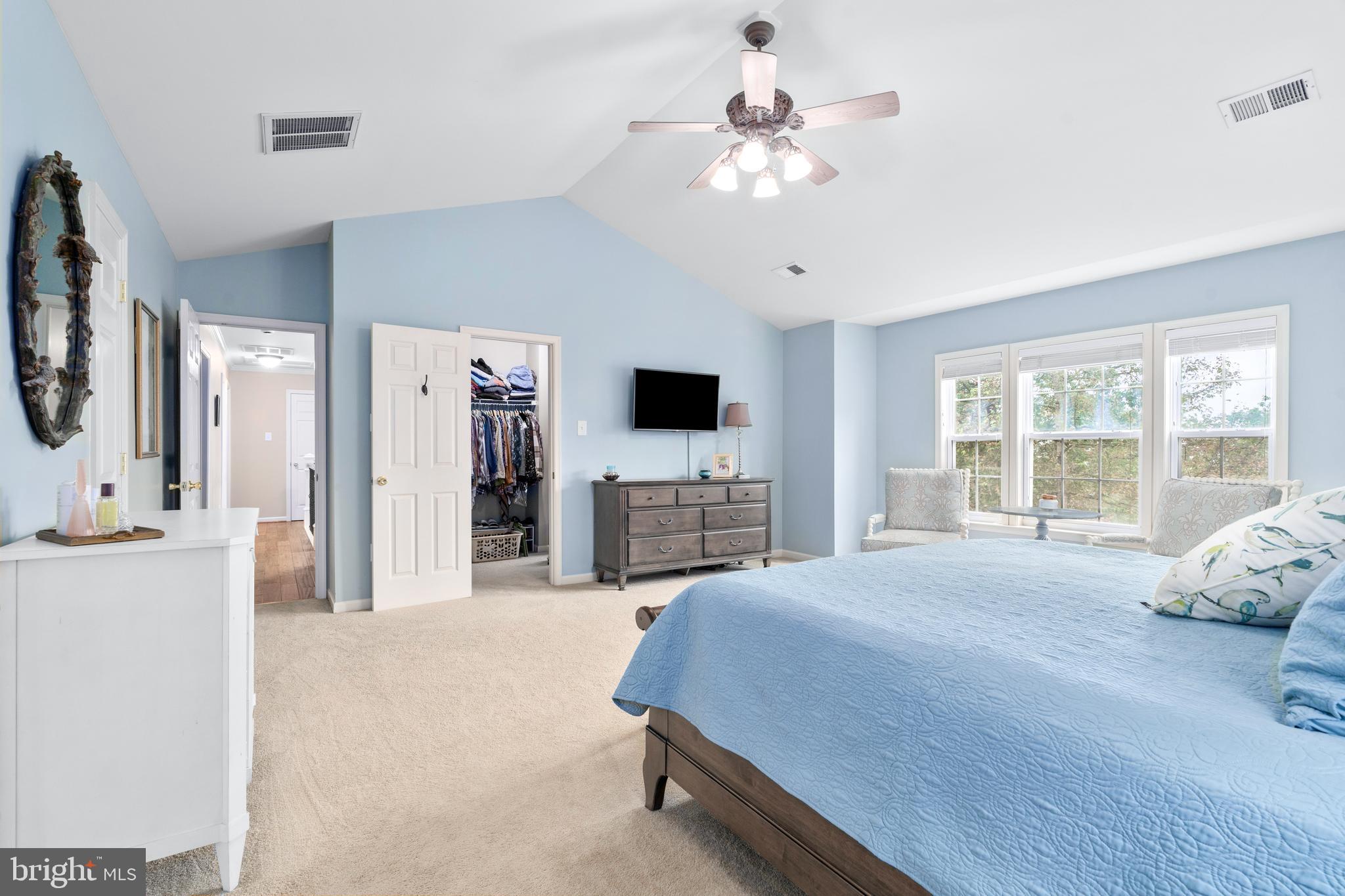 4644 Old Swimming Pool Road Braddock Heights, MD 21714 - Photo 29 of 60 a spacious bedroom with a bed and a flat screen tv