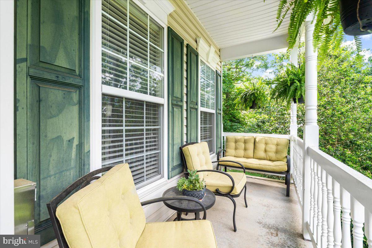 4644 Old Swimming Pool Road Braddock Heights, MD 21714 - Photo 4 of 60 a view of a chair and tables in the balcony
