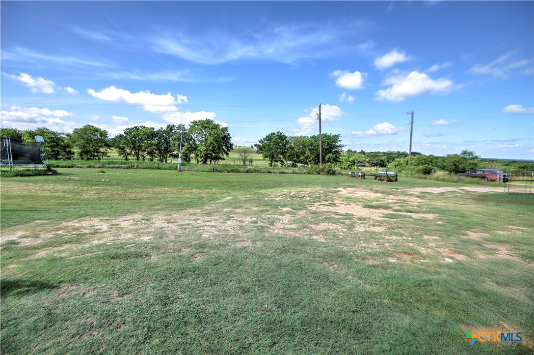 7085 Asa Road Temple, TX 76504 - Photo 14 of 16 a view of a grassy field with trees
