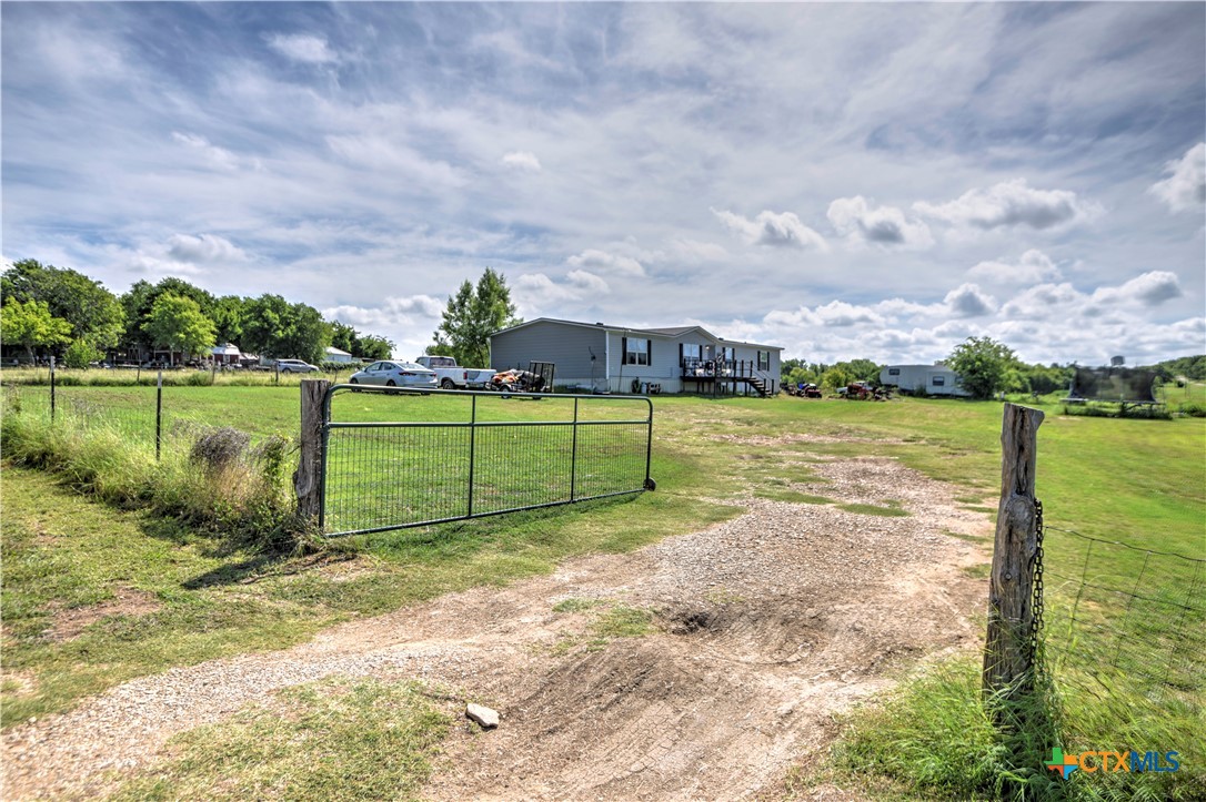 7085 Asa Road Temple, TX 76504 - Photo 2 of 16 a view of a lake with a big yard