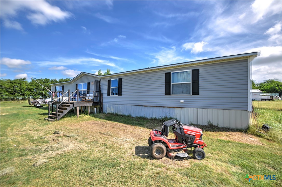 7085 Asa Road Temple, TX 76504 - Photo 3 of 16 a view of a backyard with a table and chairs