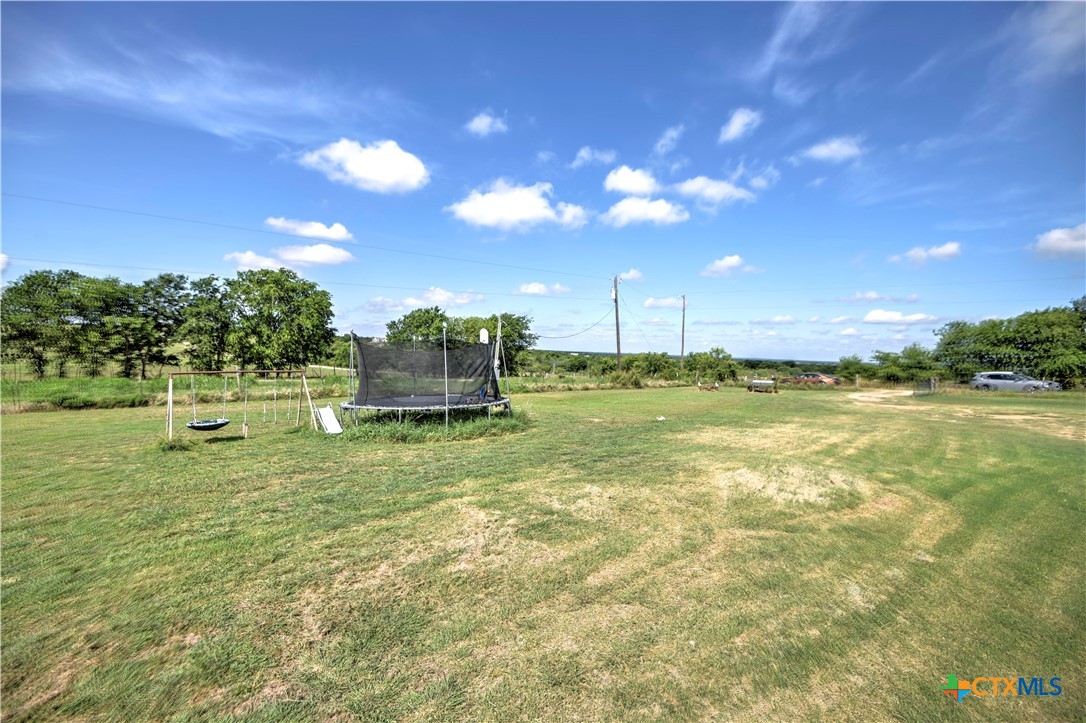 7085 Asa Road Temple, TX 76504 - Photo 5 of 16 a backyard of a house with lots of green space