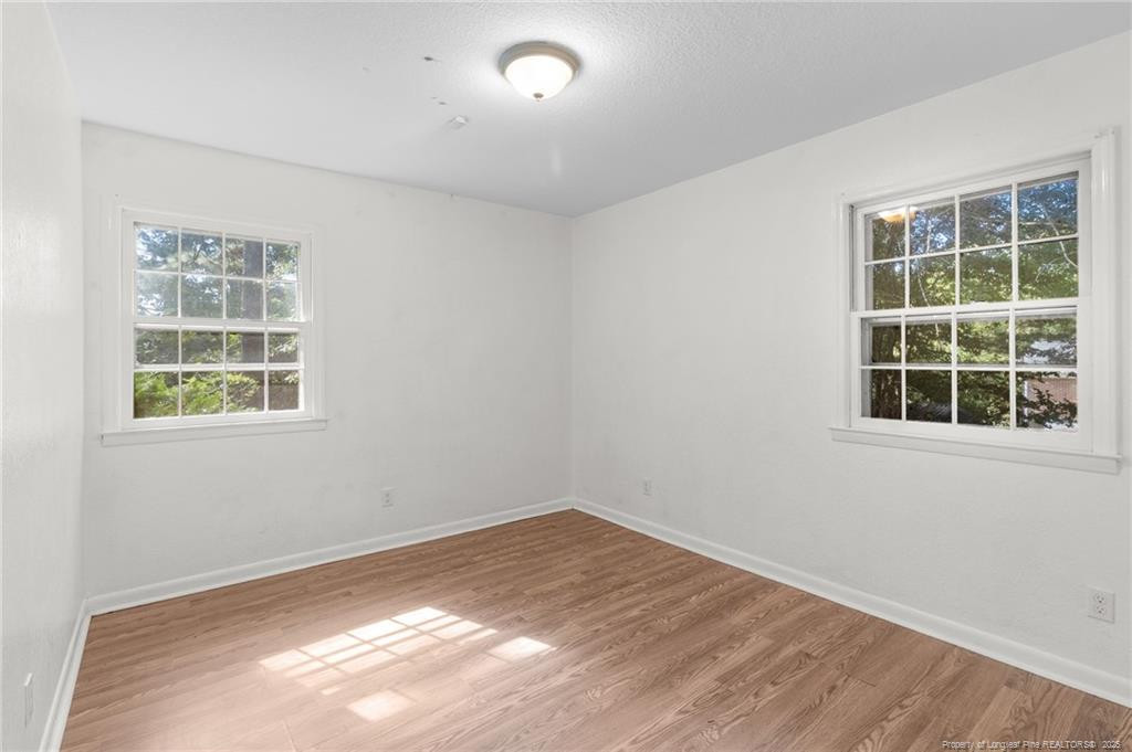 161 Summerhill Road Fayetteville, NC 28303 - Photo 12 of 36 an empty room with a window