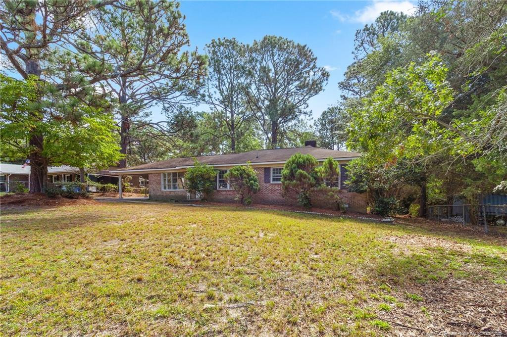 161 Summerhill Road Fayetteville, NC 28303 - Photo 3 of 36 a view of a house with pool and sitting area