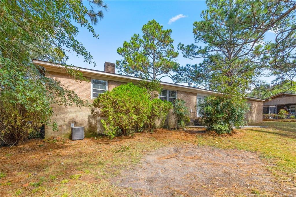 161 Summerhill Road Fayetteville, NC 28303 - Photo 33 of 36 a view of a house with backyard and tree