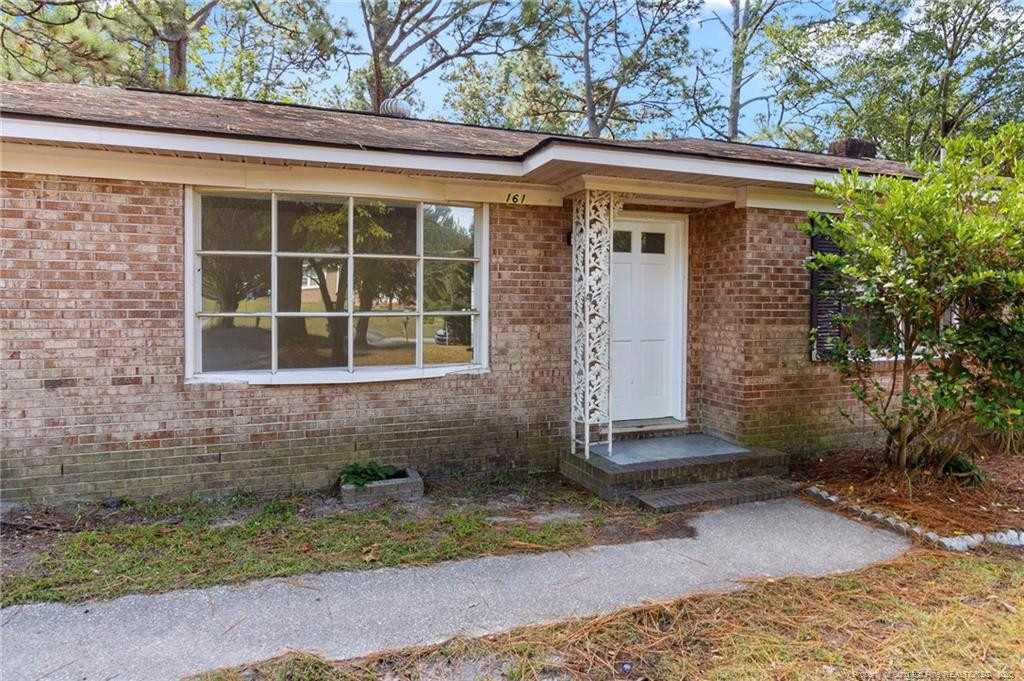 161 Summerhill Road Fayetteville, NC 28303 - Photo 6 of 36 a front view of a house with a yard