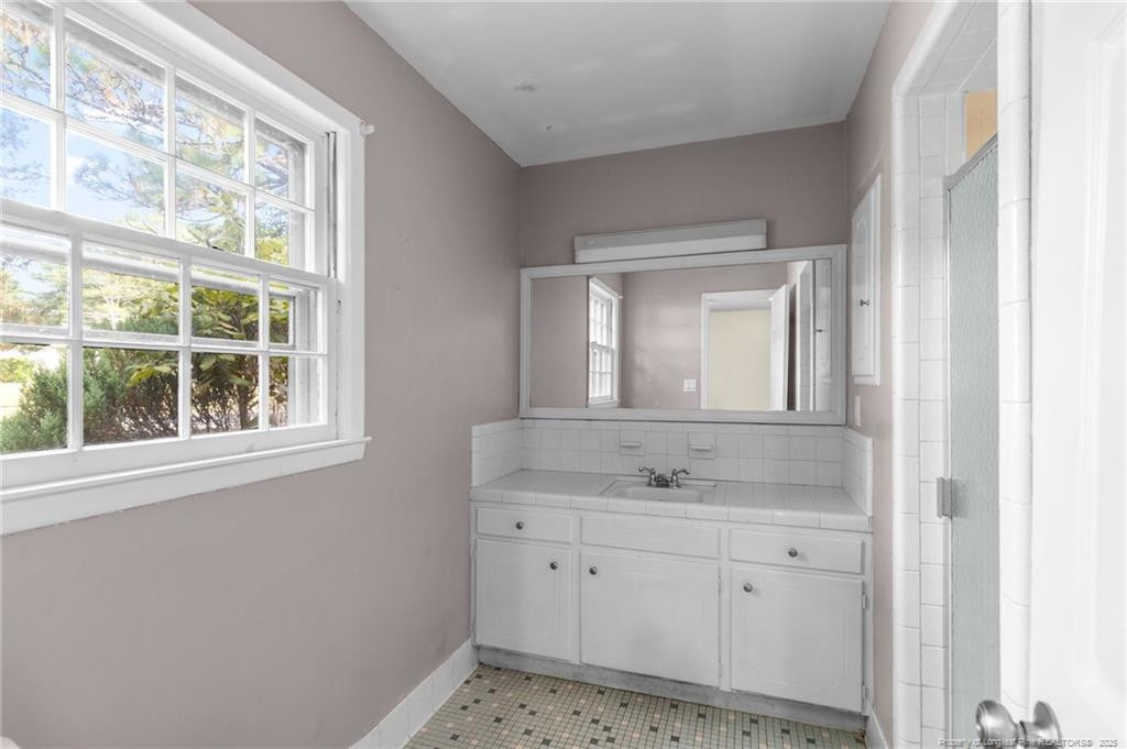 161 Summerhill Road Fayetteville, NC 28303 - Photo 9 of 36 a bathroom with a sink and a mirror