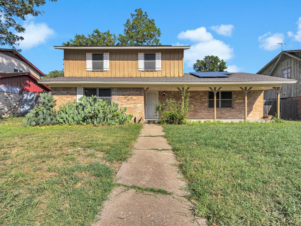 11051 Ferguson Road Dallas, TX 75228 - Photo 1 of 1 a front view of a house with a yard and potted plants