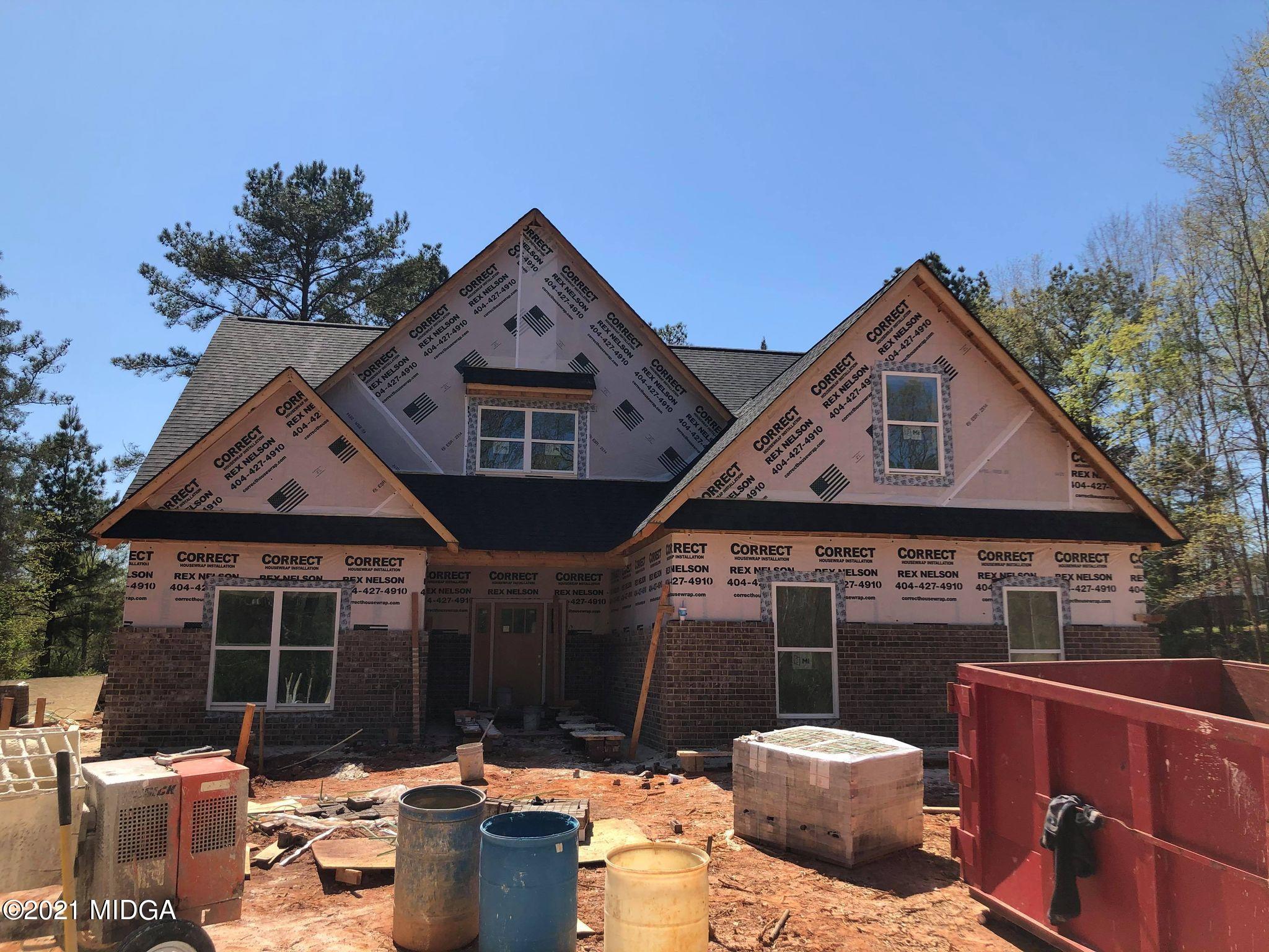 948 Chappell Mill Road Milner, GA 30257 - Photo 1 of 5 a front view of a house with a yard