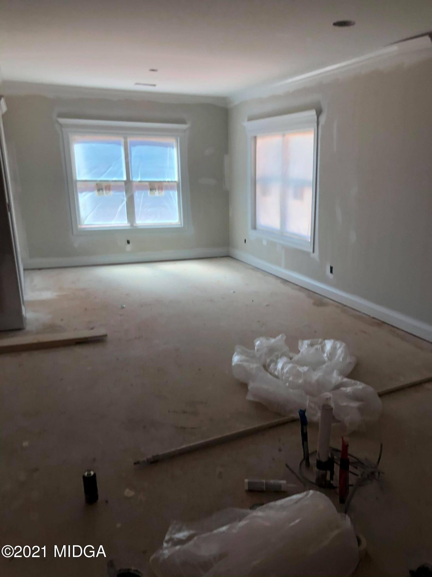 948 Chappell Mill Road Milner, GA 30257 - Photo 3 of 5 a view of a livingroom with chair and window