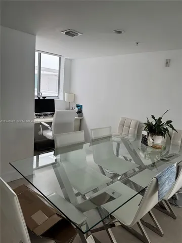 a living room with couches and a flat screen tv