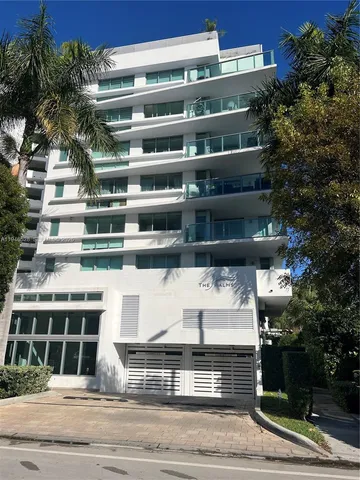 a view of a building and car parked