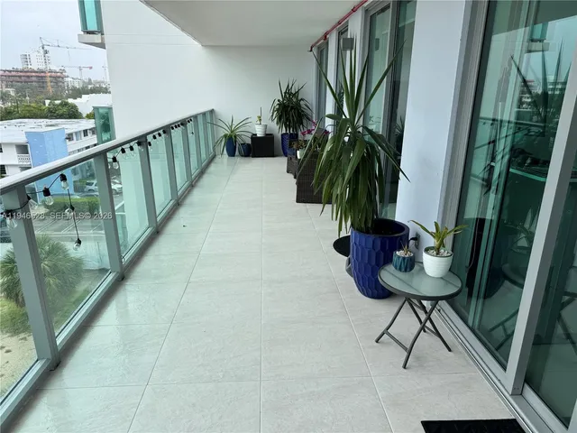 a view of balcony with furniture