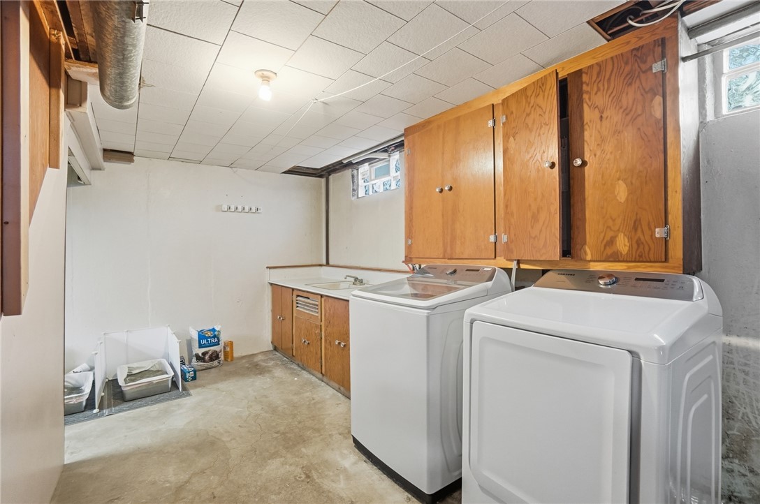 1325 Chelsea Road Troy, OH 45373 - Photo 34 of 42 Functional basement laundry area, ready for daily tasks.