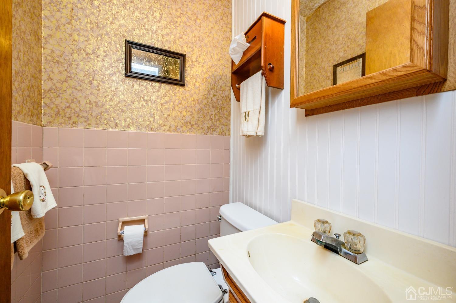 334 High Street Perth Amboy, NJ 08861 - Photo 14 of 33 a bathroom with a sink and a toilet