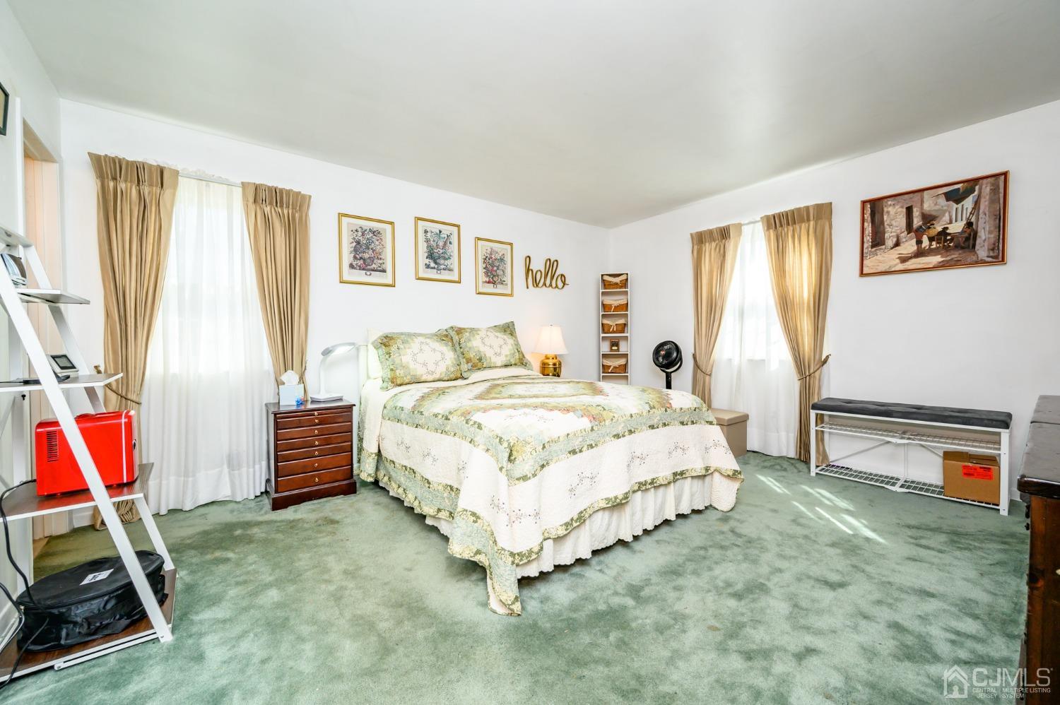 334 High Street Perth Amboy, NJ 08861 - Photo 15 of 33 a bedroom with a bed and a dresser