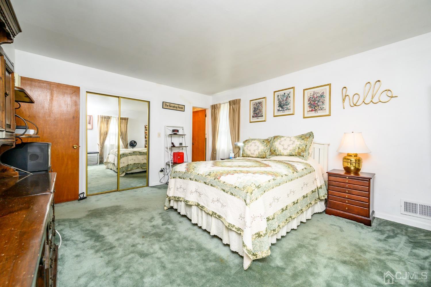 334 High Street Perth Amboy, NJ 08861 - Photo 17 of 33 a spacious bedroom with a bed and a window