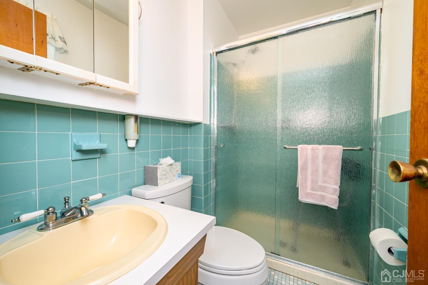 334 High Street Perth Amboy, NJ 08861 - Photo 18 of 33 a bathroom with a sink toilet and shower