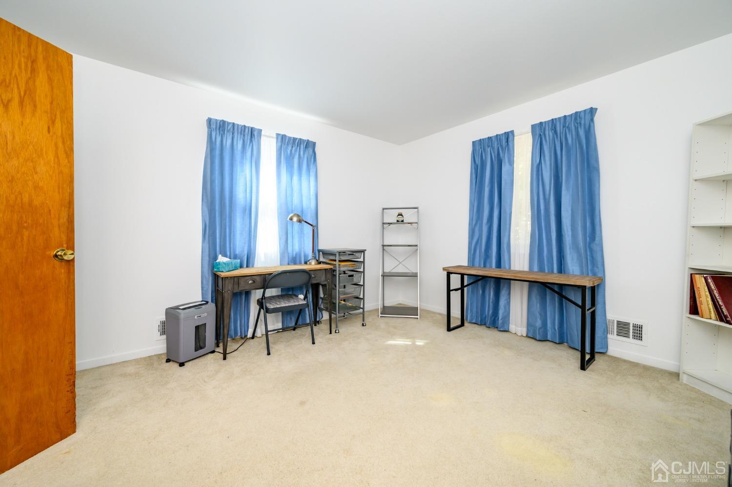 334 High Street Perth Amboy, NJ 08861 - Photo 19 of 33 a view of room with furniture and windows