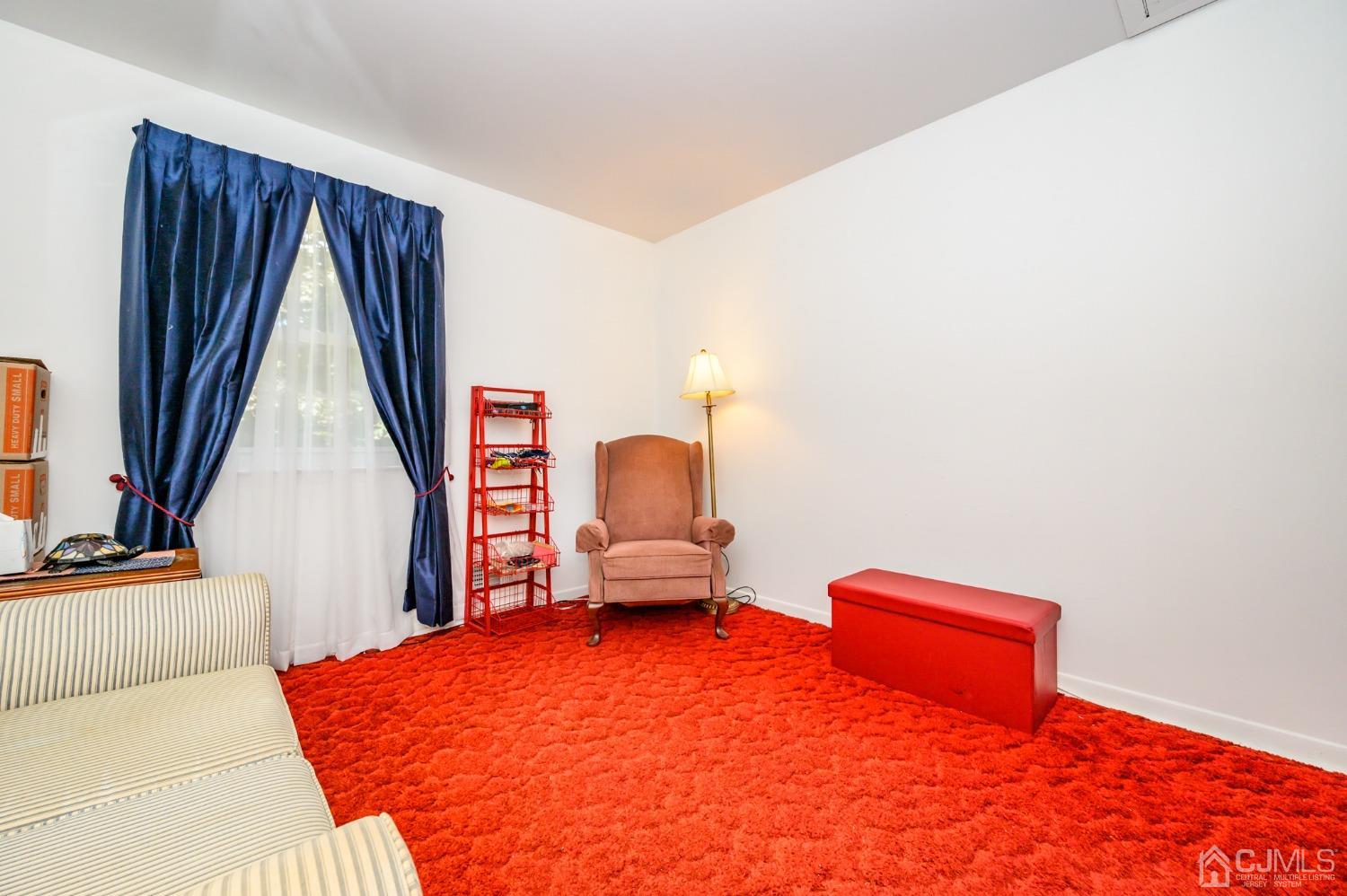 334 High Street Perth Amboy, NJ 08861 - Photo 22 of 33 a bedroom with a bed and a large window