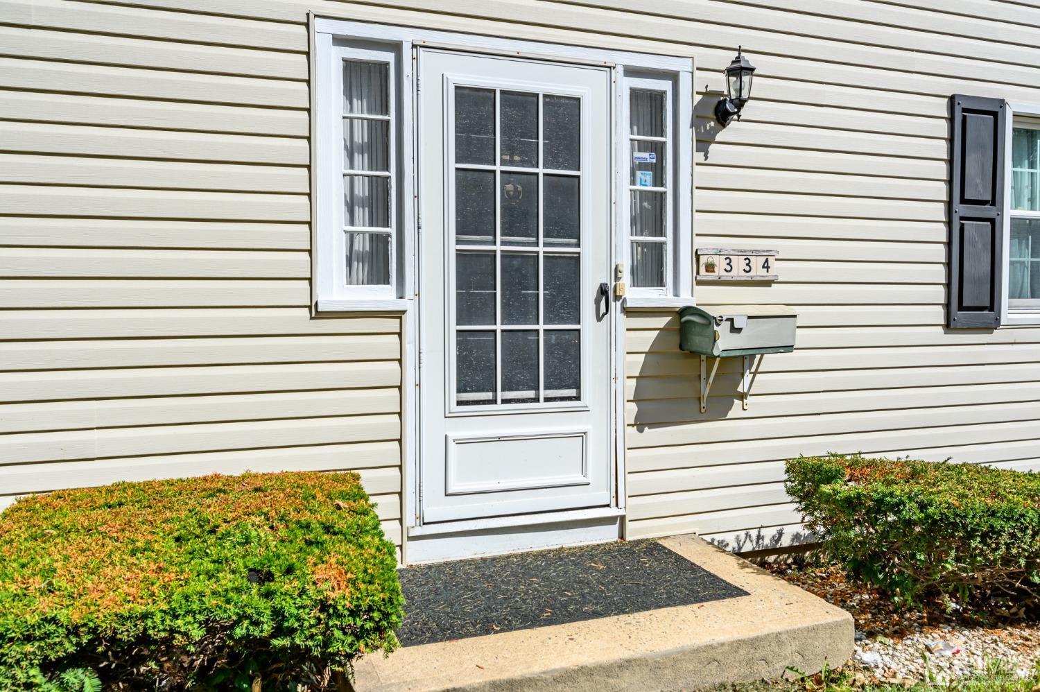 334 High Street Perth Amboy, NJ 08861 - Photo 3 of 33 a view of a house with a door and a tree