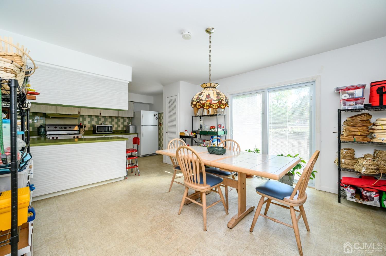 334 High Street Perth Amboy, NJ 08861 - Photo 7 of 33 a view of a dining room and furniture window and outside view