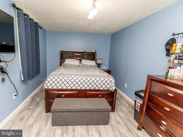 a bedroom with a bed and a cabinets