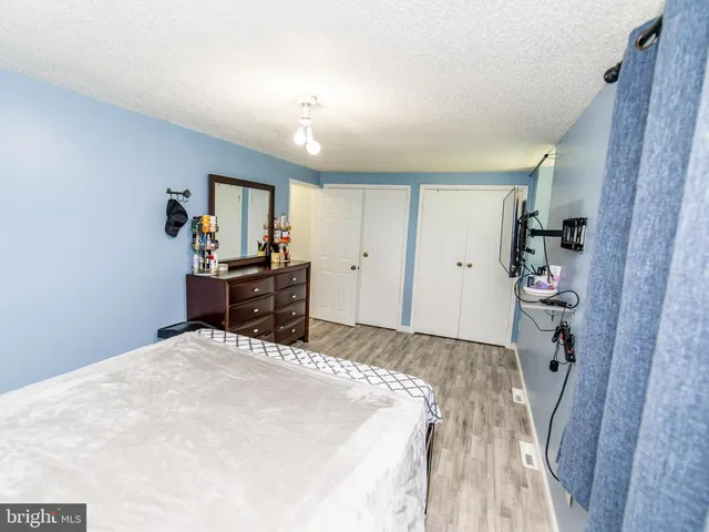 a bathroom with a toilet a sink and a window