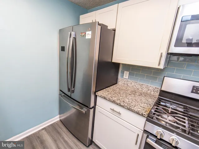 a view of a utility room with wooden floor
