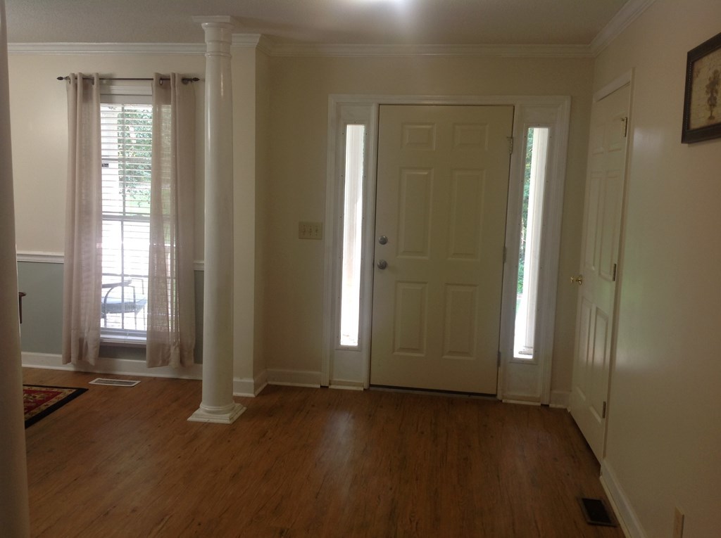 356 Elam Church Road Gray, GA 31032 - Photo 2 of 28 an empty room with windows and entrance