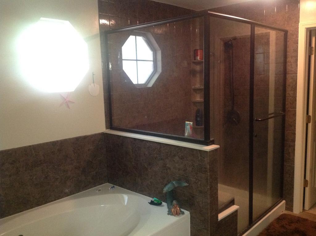 356 Elam Church Road Gray, GA 31032 - Photo 15 of 28 a bathroom with a bathtub