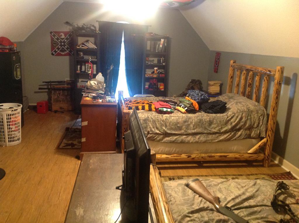 356 Elam Church Road Gray, GA 31032 - Photo 20 of 28 a bed sitting in a bedroom next to a window