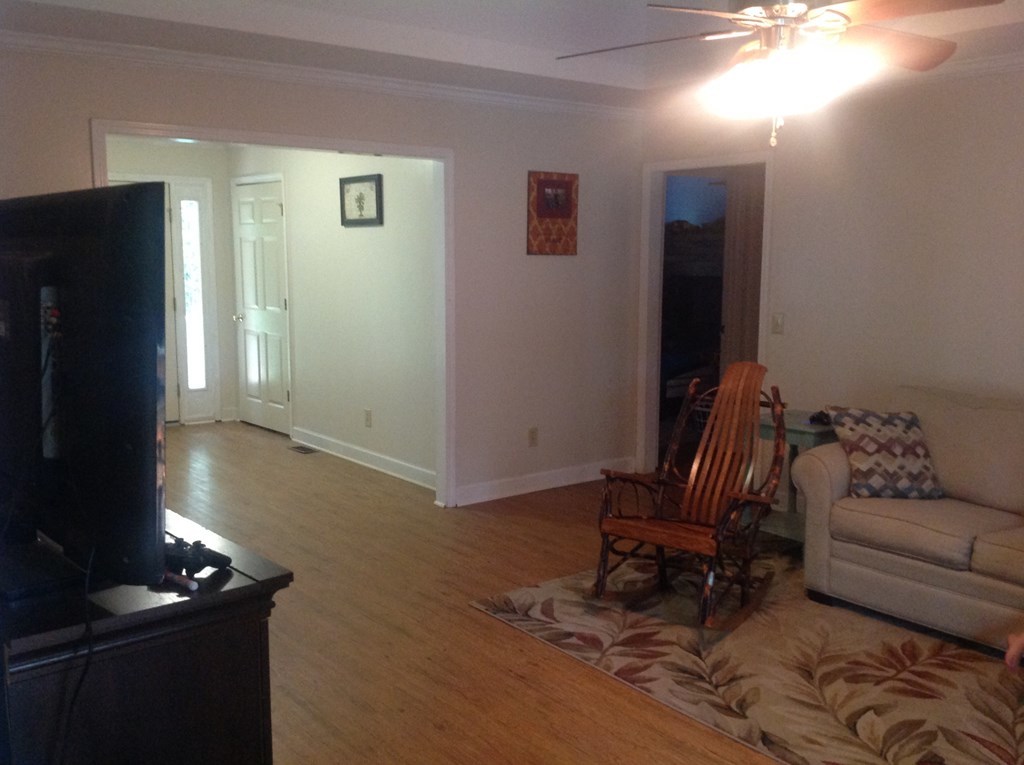 356 Elam Church Road Gray, GA 31032 - Photo 4 of 28 a living room with furniture and a flat screen tv