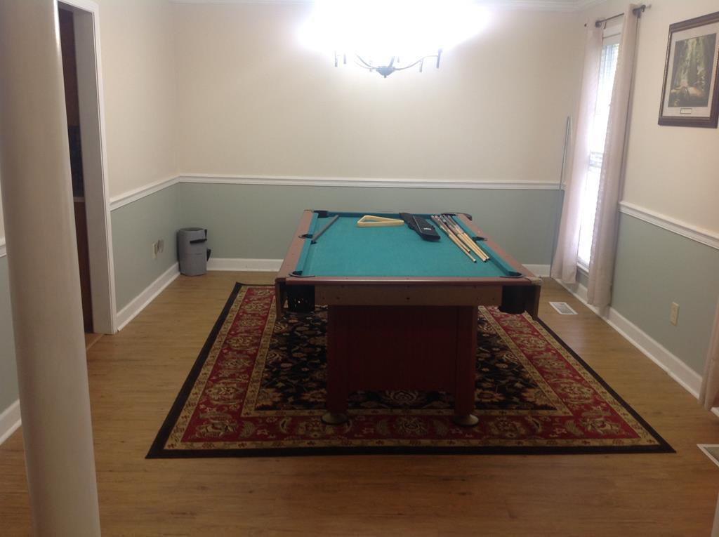 356 Elam Church Road Gray, GA 31032 - Photo 6 of 28 a room with water heater and wooden floor