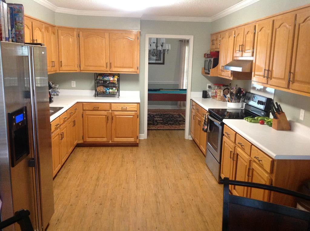 356 Elam Church Road Gray, GA 31032 - Photo 8 of 28 a kitchen with stainless steel appliances granite countertop a stove a sink dishwasher and a refrigerator