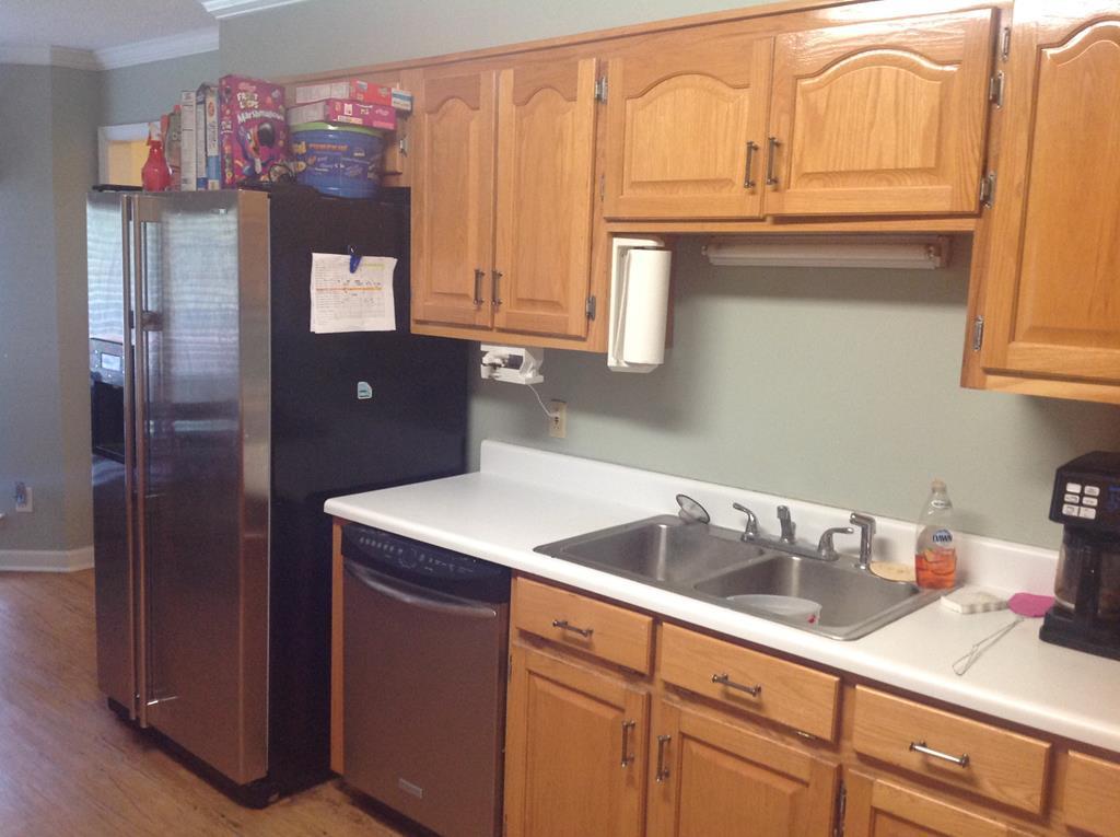 356 Elam Church Road Gray, GA 31032 - Photo 9 of 28 a kitchen with stainless steel appliances granite countertop a refrigerator and a sink