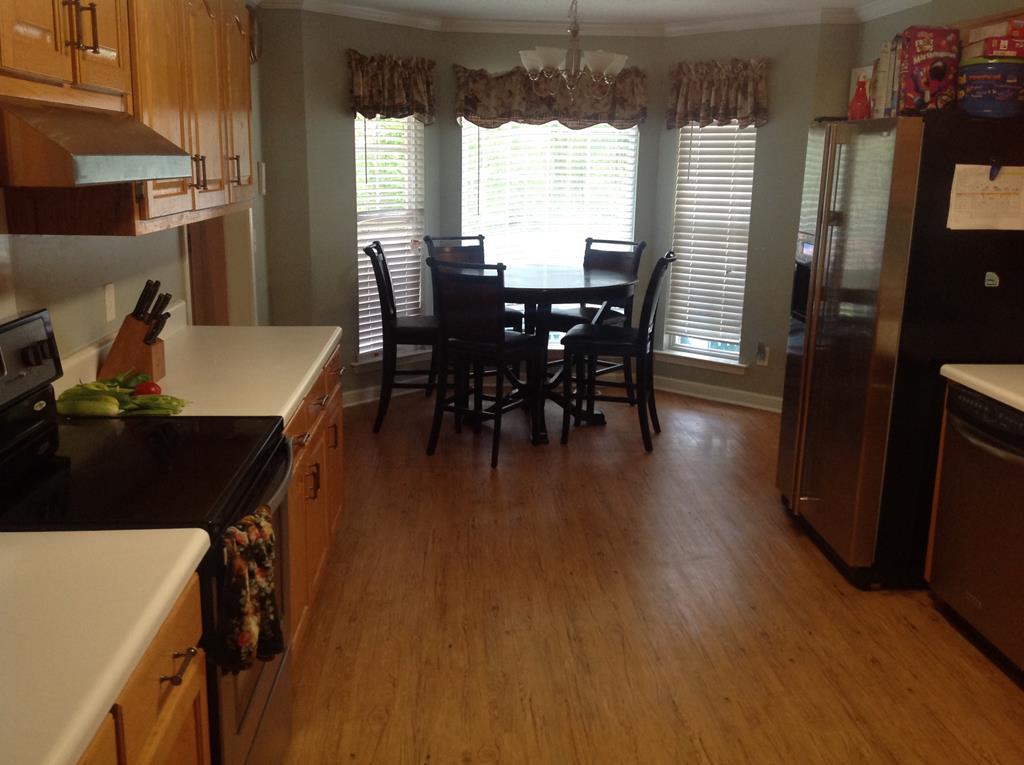 356 Elam Church Road Gray, GA 31032 - Photo 10 of 28 a view of a dining room with furniture window and wooden floor
