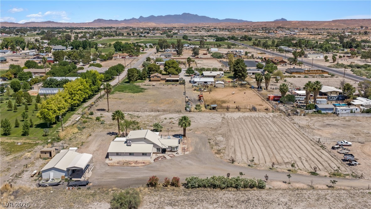 750 Leming Avenue Overton, NV 89040 - Photo 79 of 82 This aerial view showcases a residential property nestled amidst expansive natural surroundings.