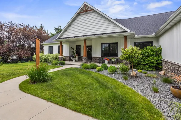 a front view of house with yard and green space