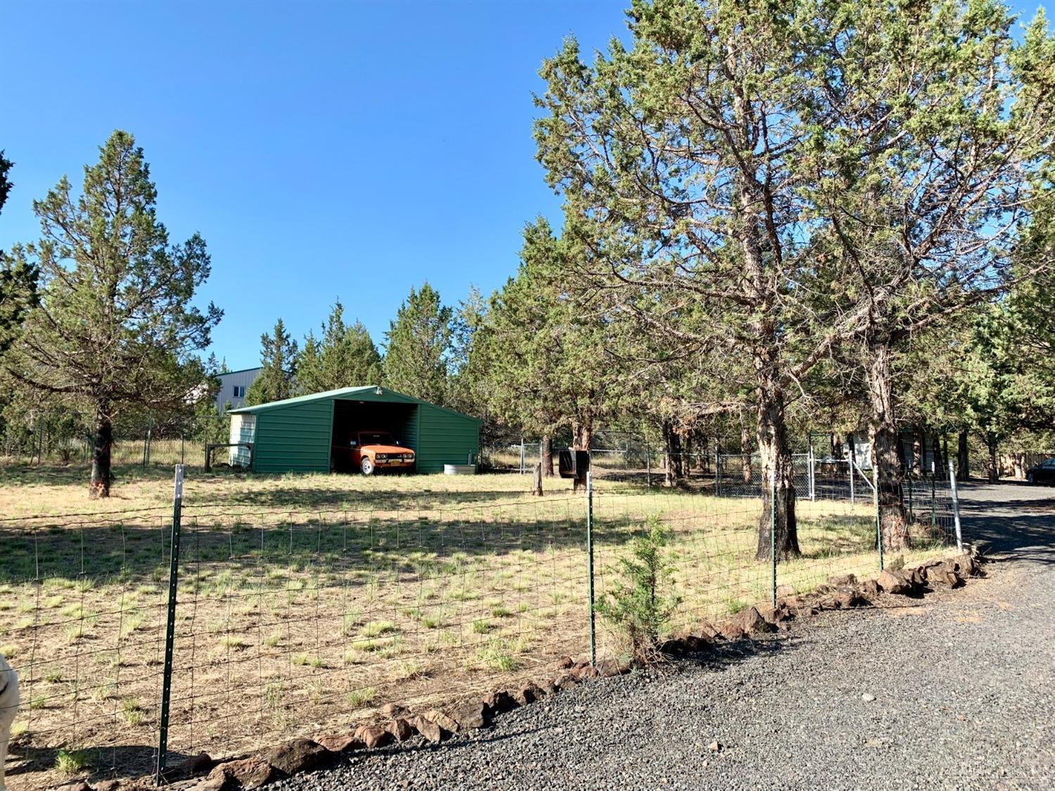 6565 Southeast Canyon Road Prineville, OR 97754 - Photo 20 of 25 Front pasture with barn