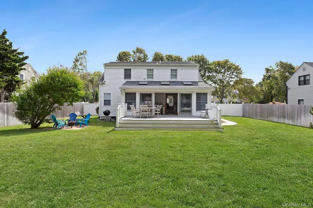 a view of a house with a yard porch and sitting area