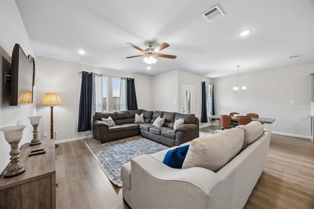 638 Hazeltine Road Red Oak, TX 75154 - Photo 14 of 29 a living room with furniture and a flat screen tv