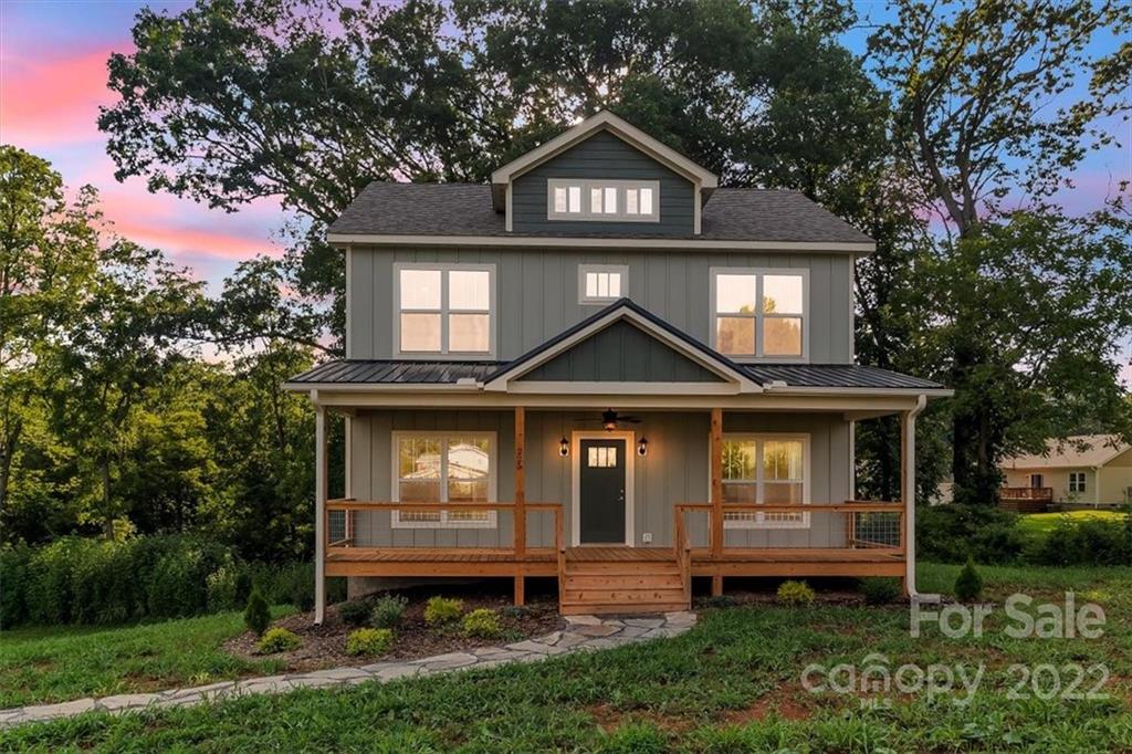 225 Ridge View Drive, Unit 16 Clyde, NC 28721 - Photo 1 of 29 a front view of a house with garden